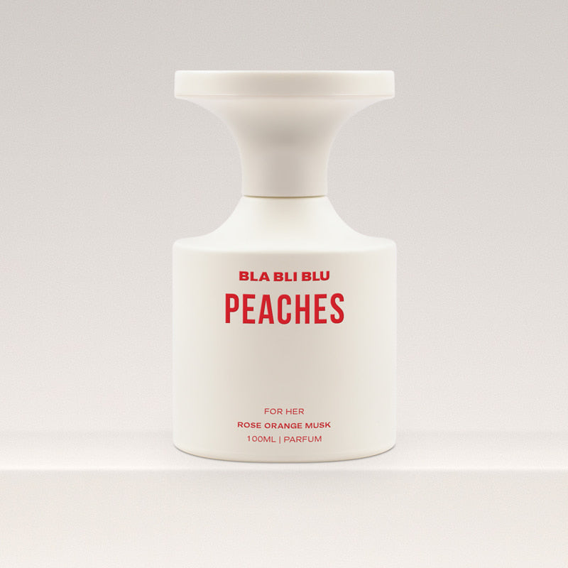 Perfume bottle labeled 'PEACHES' by BLA BLU on a white background
