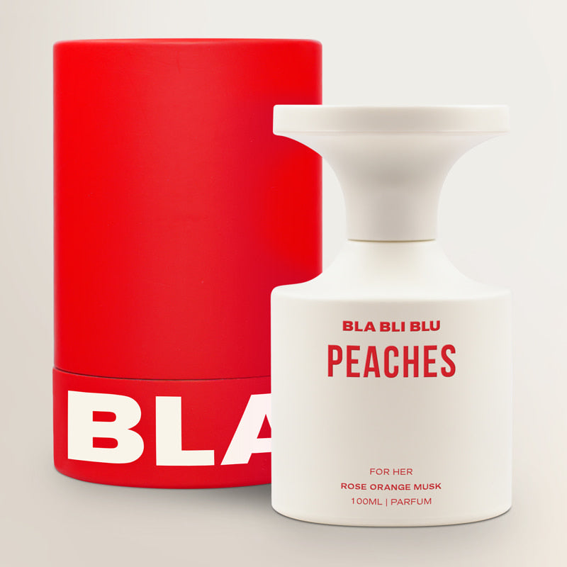 Red container and white perfume bottle with 'BLA BLU' branding on a light gray background