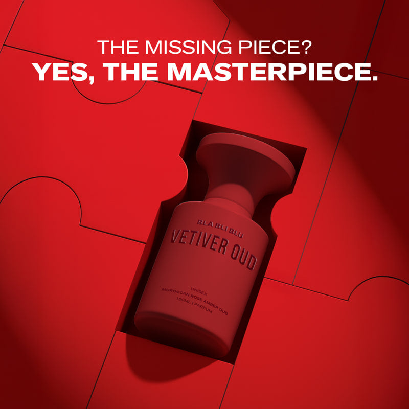 Red bottle labeled 'Vetiver Oud' on a red background with text 'The Missing Piece? Yes, The Masterpiece.'