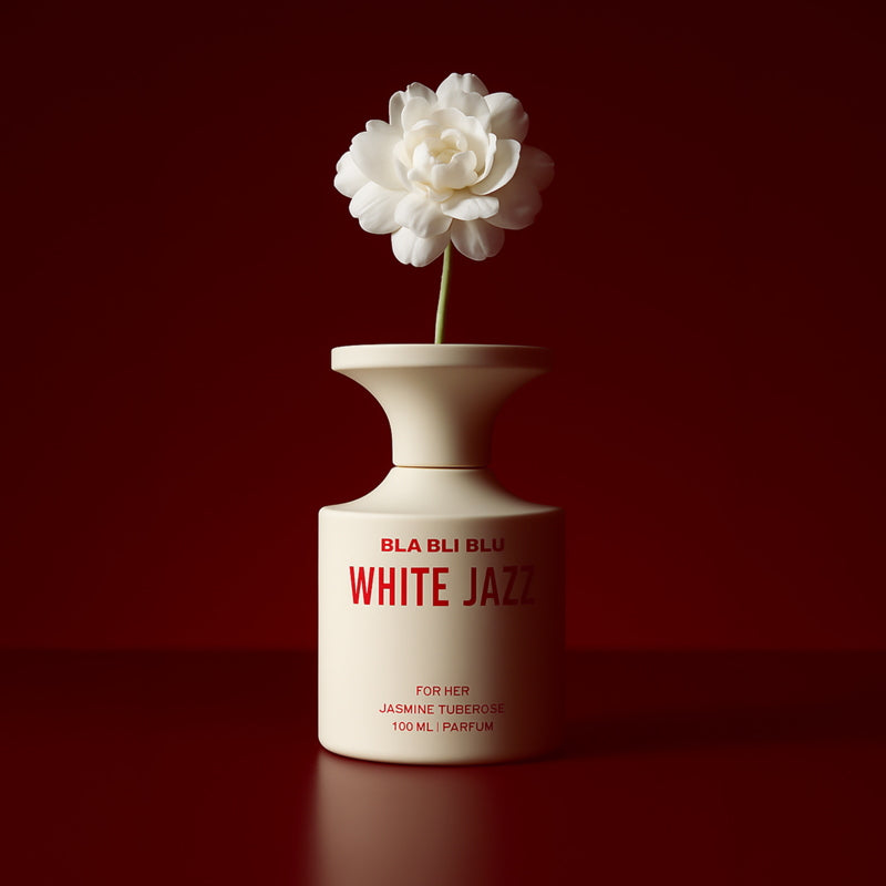 Perfume bottle labeled 'White Jazz' with a white flower on a red background