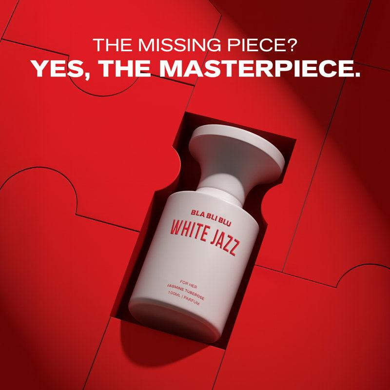 White bottle labeled 'White Jazz' on a red background with text 'The Missing Piece? Yes, The Masterpiece.'